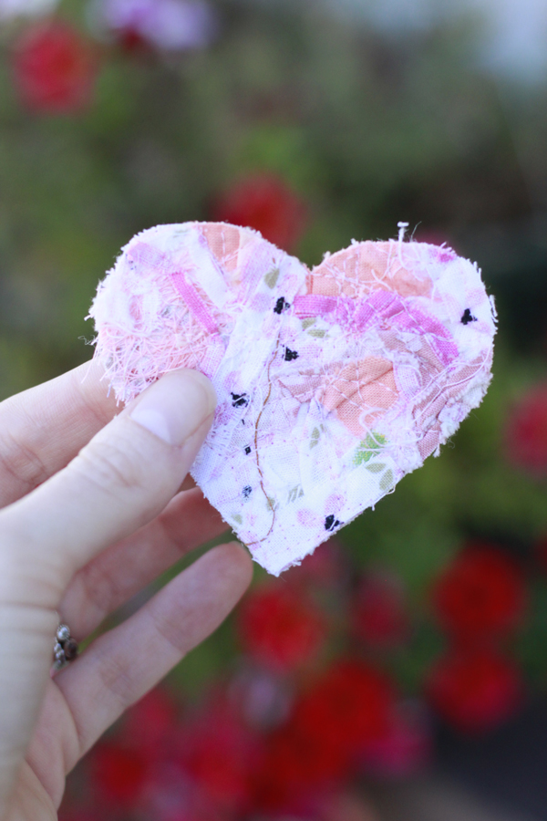 pink scraps of fabric sewn together and cut into a heart. 