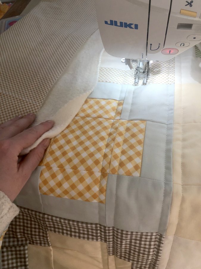 plus quilt being quilted in a juki sewing machine