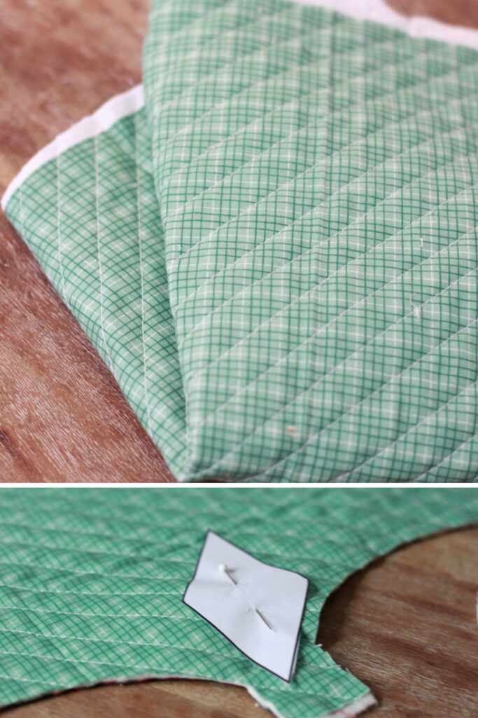 Green quilted material. Template pinned on to christmas fabric and ready to cut