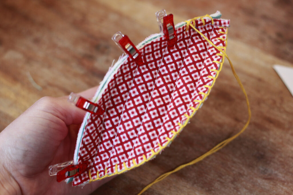 body of the christmas ornament created with the blanket stitch and christmas quilt